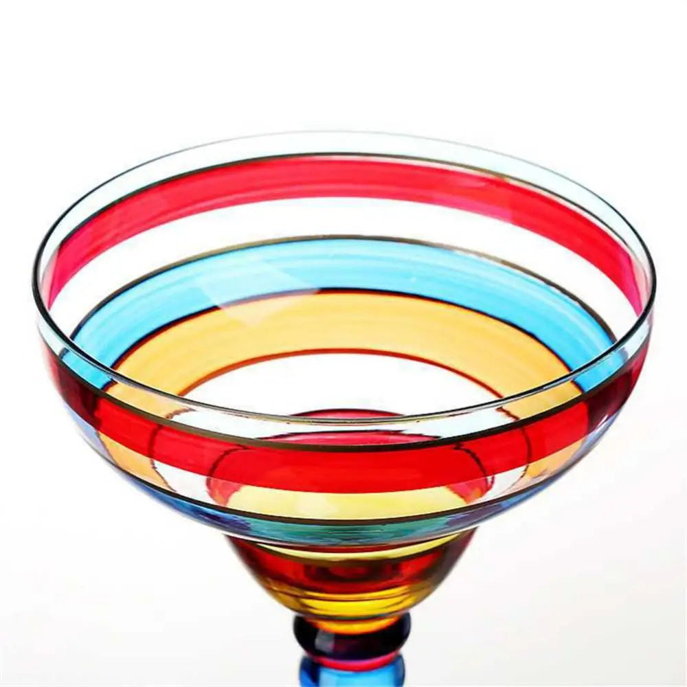Colorful glass bowl with concentric circular design on a white background