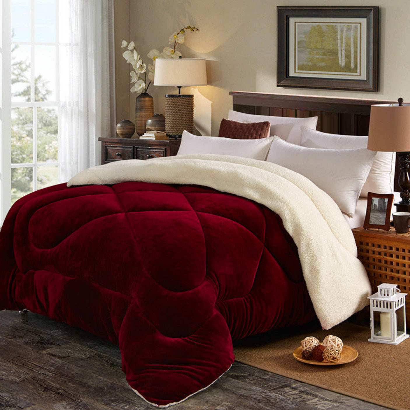 Bed with red and white comforter in a bedroom setting