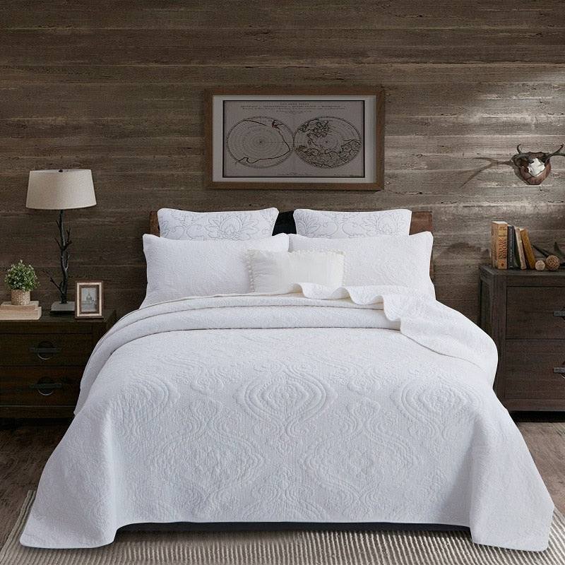 Heirloom Patchwork™ Quilt Collection cotton patchwork quilt set on bed with pillows