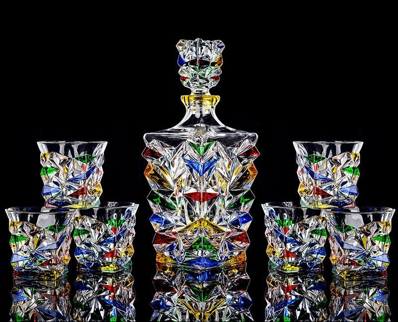 Colorful hand-painted glass decanter set with ice crack design on a black background