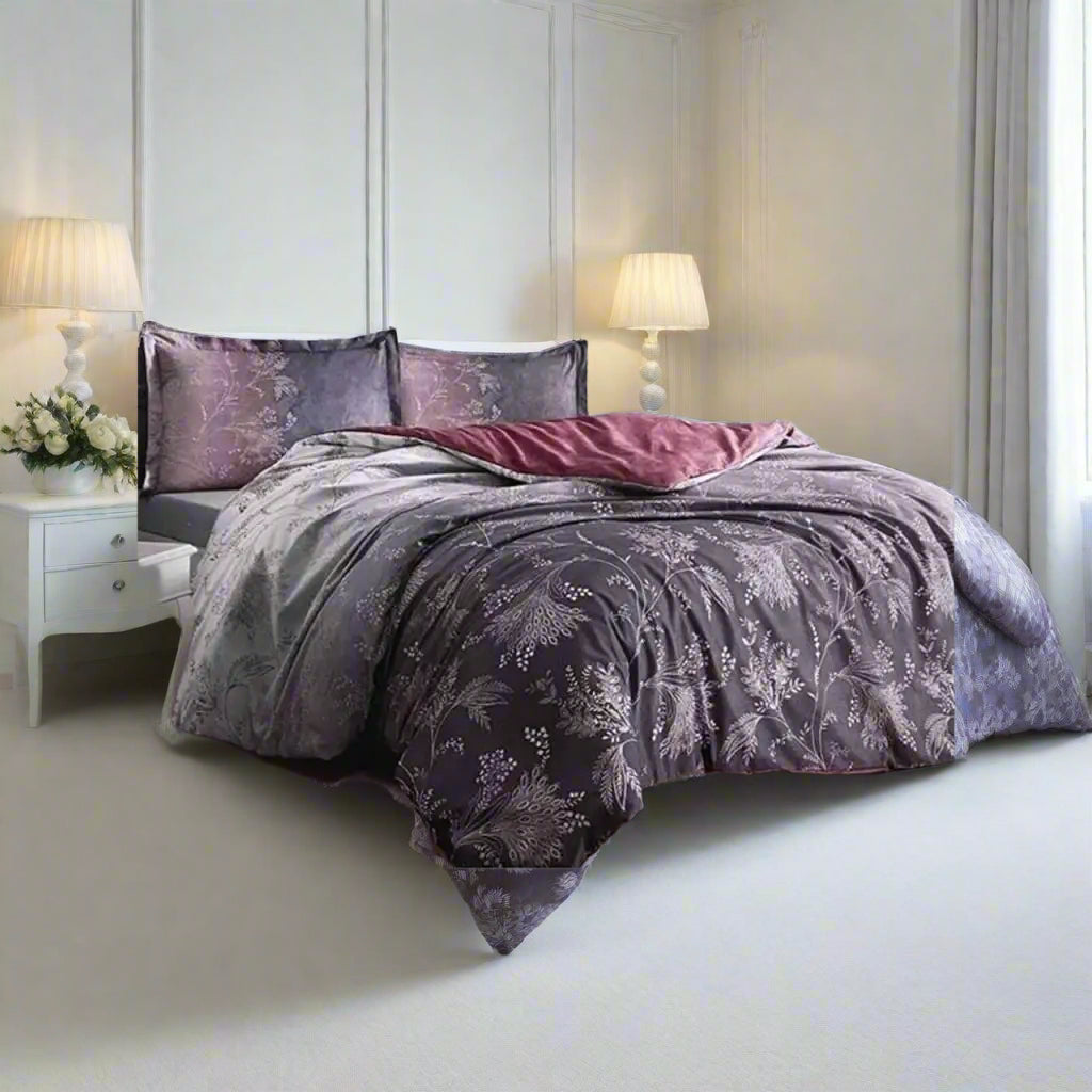 Bed with purple floral bedding in a bedroom setting