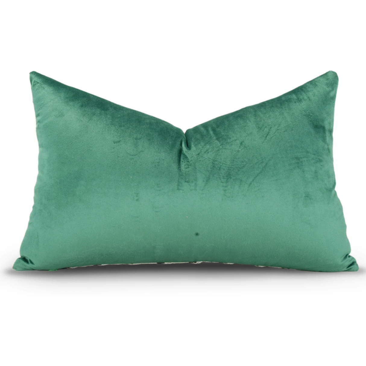 Green velvet pillow on a white background