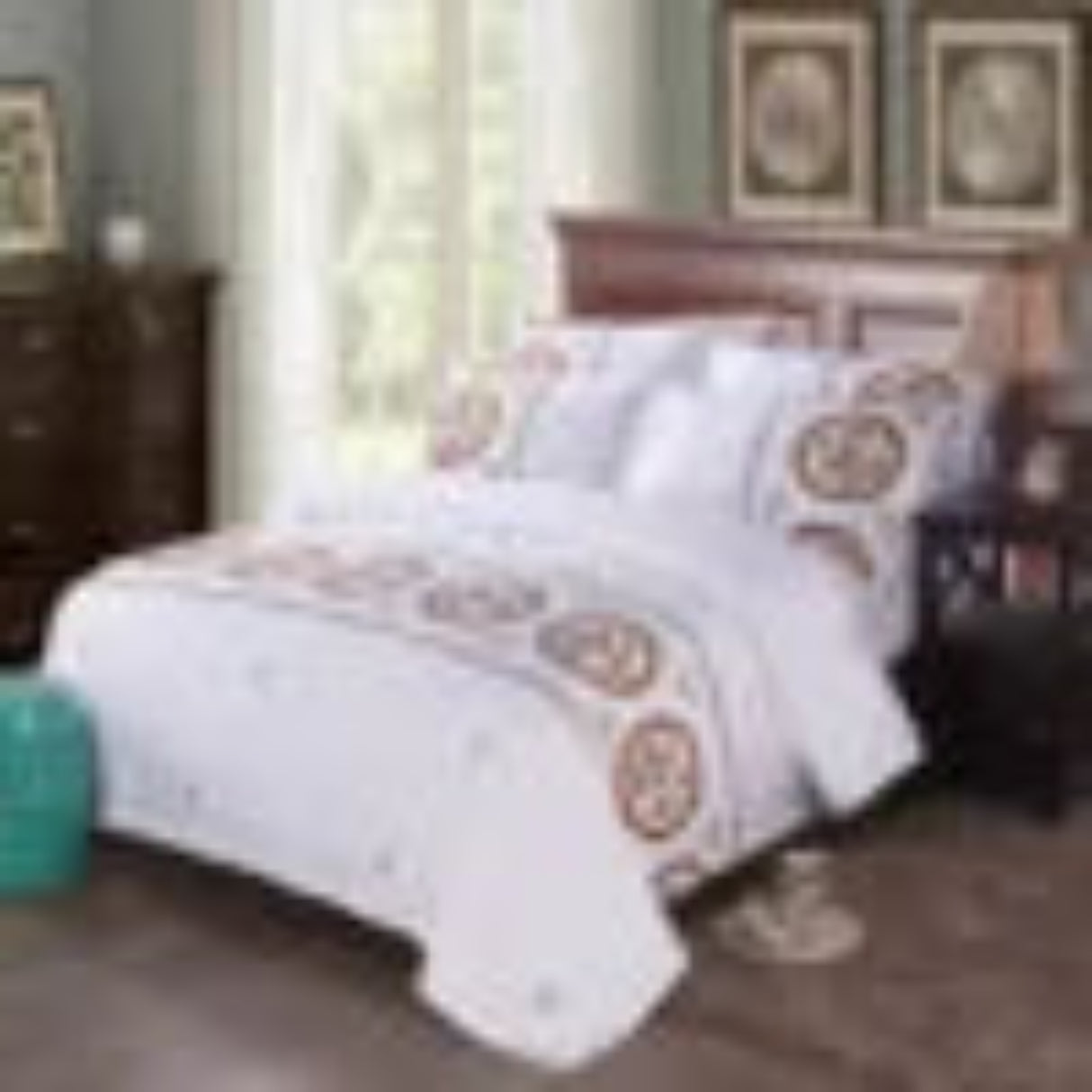 Bedding set with decorative pillows on a bed