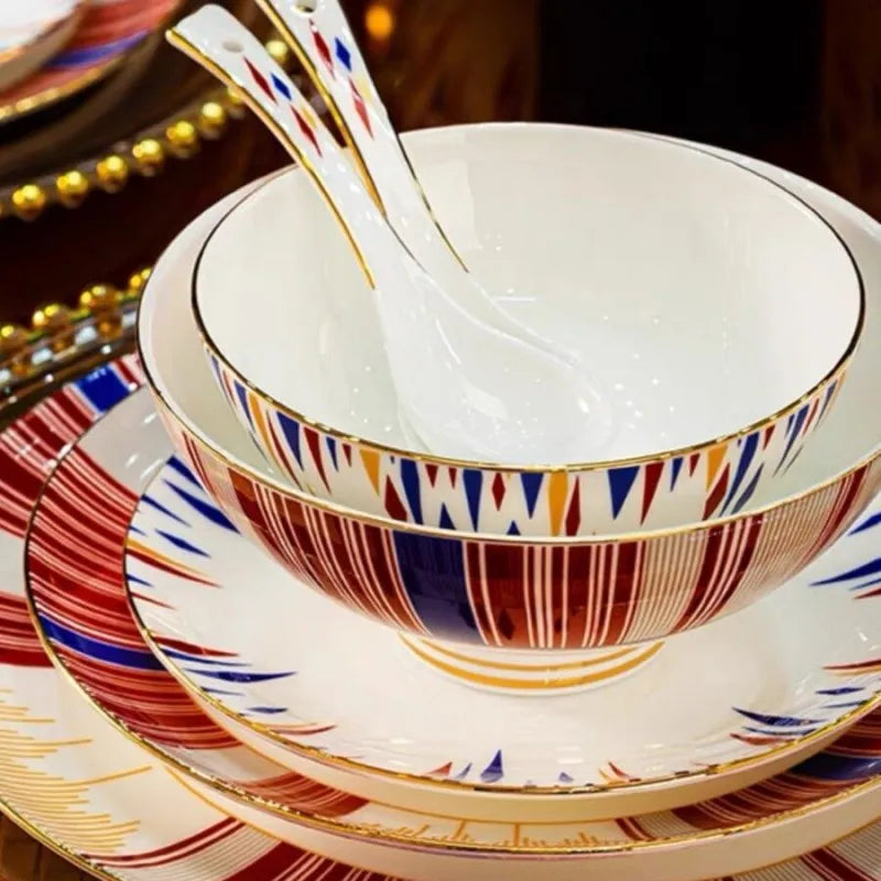 Decorative ceramic bowl and saucer set with geometric pattern on a dark background
