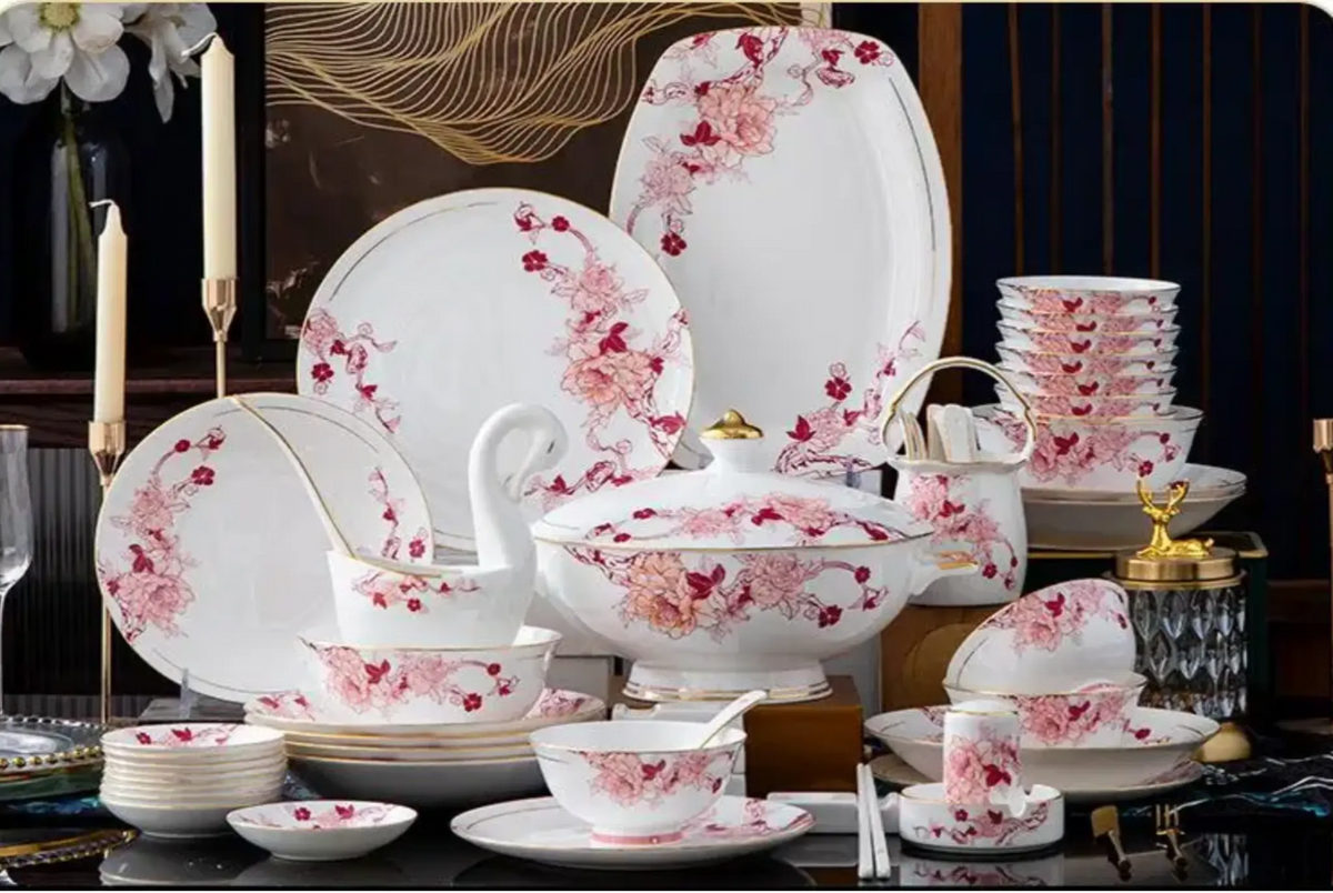 Ceramic dinnerware set with floral patterns on a dark background