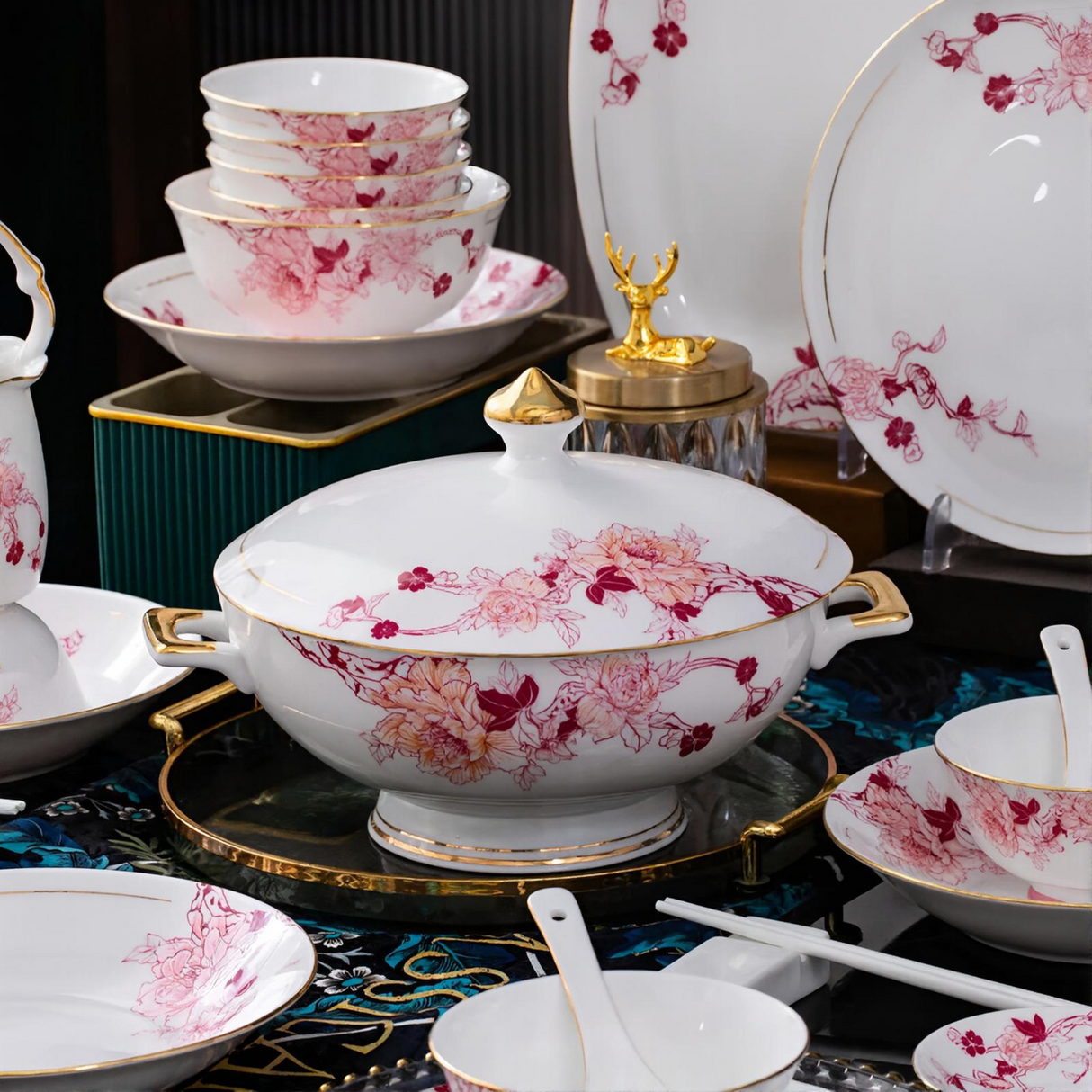 Set of ceramic dishes with floral patterns on a dark surface