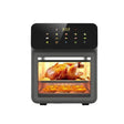 Black smart oven with a roasted chicken and baked goods inside on a white background
