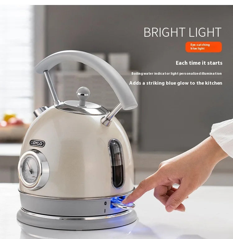 Electric kettle with a hand pressing a button, set against a kitchen background.