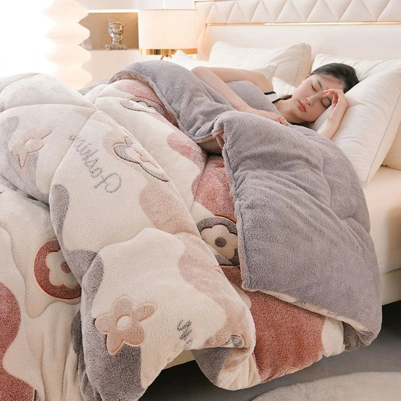 Person lying on a bed under a floral-patterned blanket with cartoon characters.