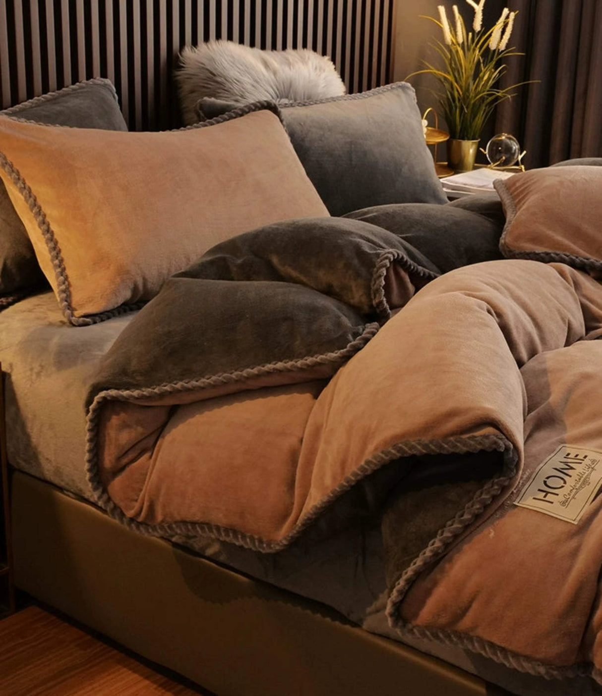 Brown blanket draped over a sofa with pillows in a cozy living room setting.