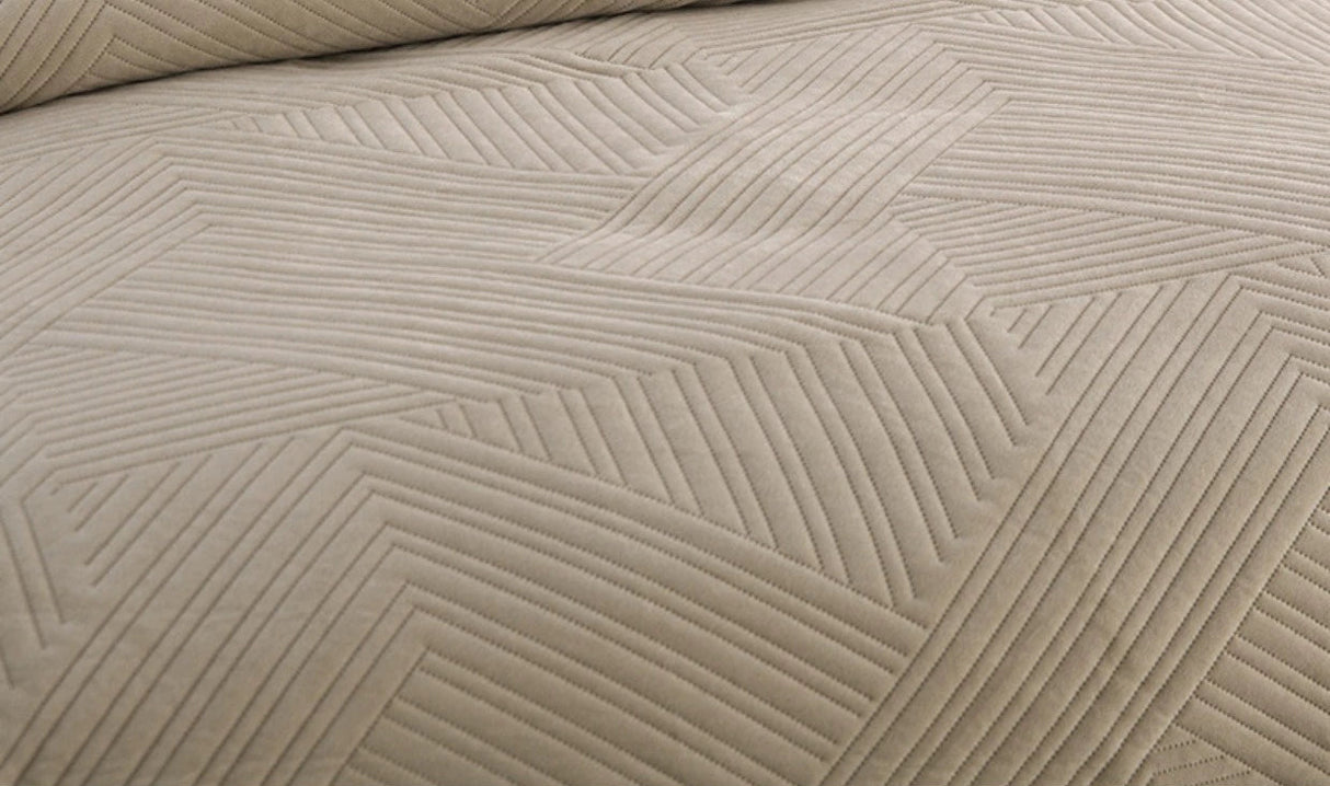 Textured beige fabric with a geometric pattern