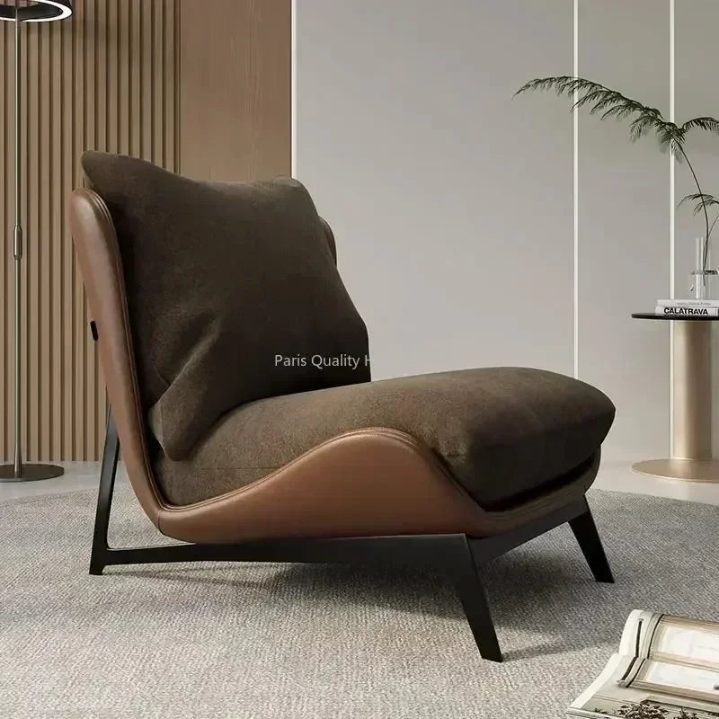 Brown armchair with a pillow in a modern interior setting