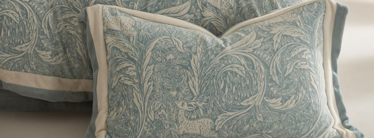 Decorative pillows on a bed with text about fabric weaving and matting process.