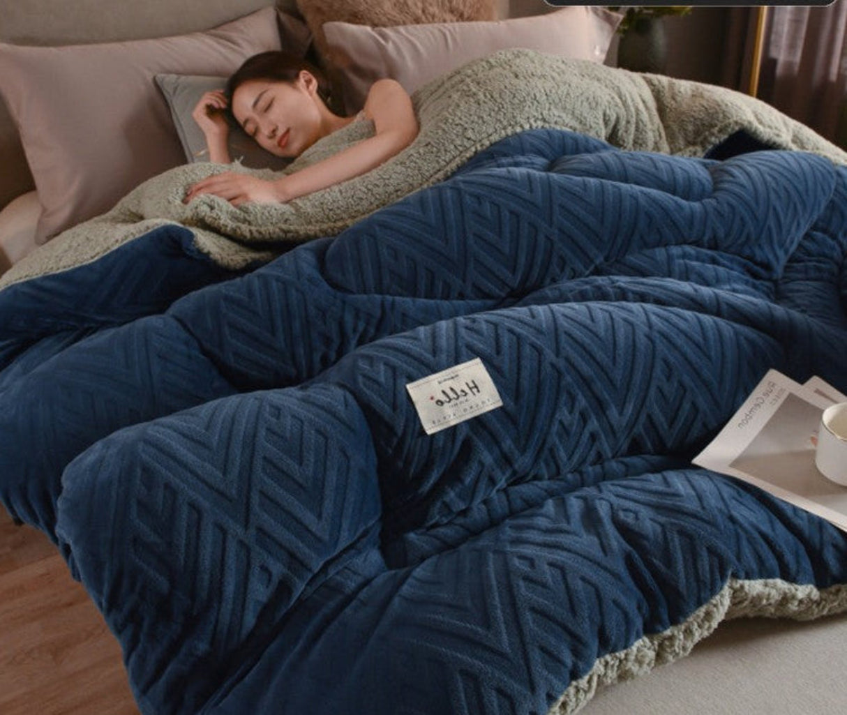 Woman sleeping under a blue weighted blanket with product details on a white background