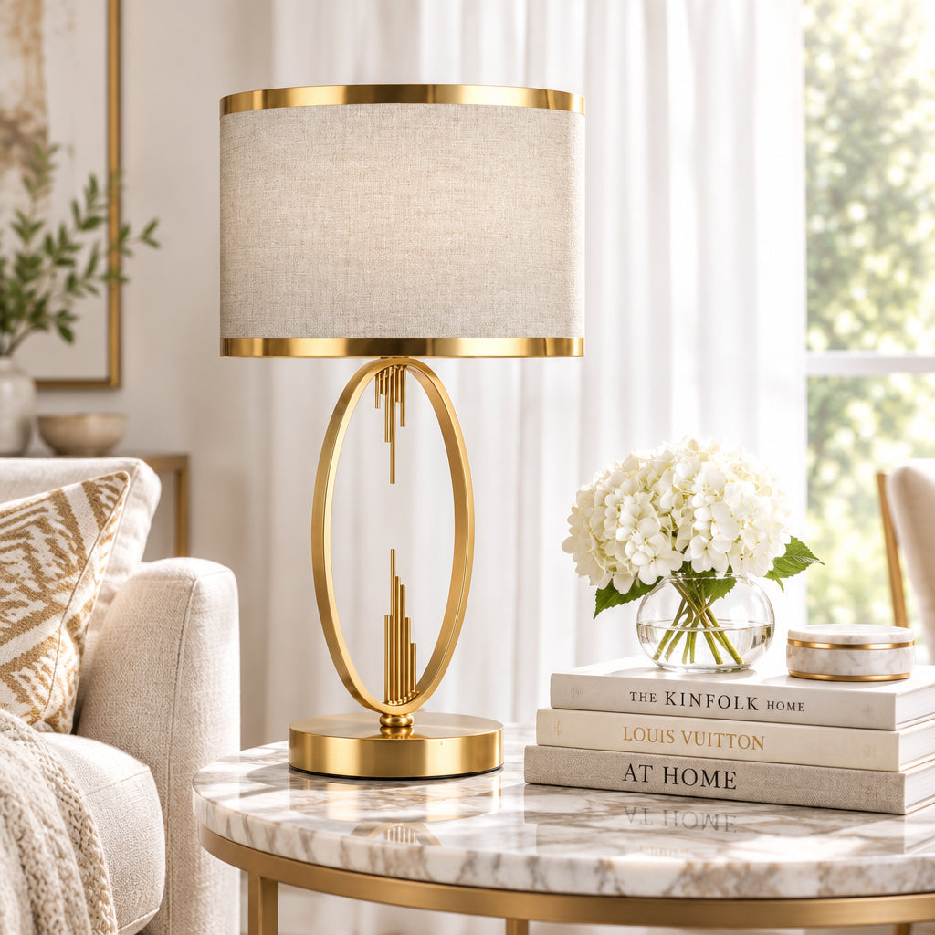 Table lamp with gold base and trim on a white background
