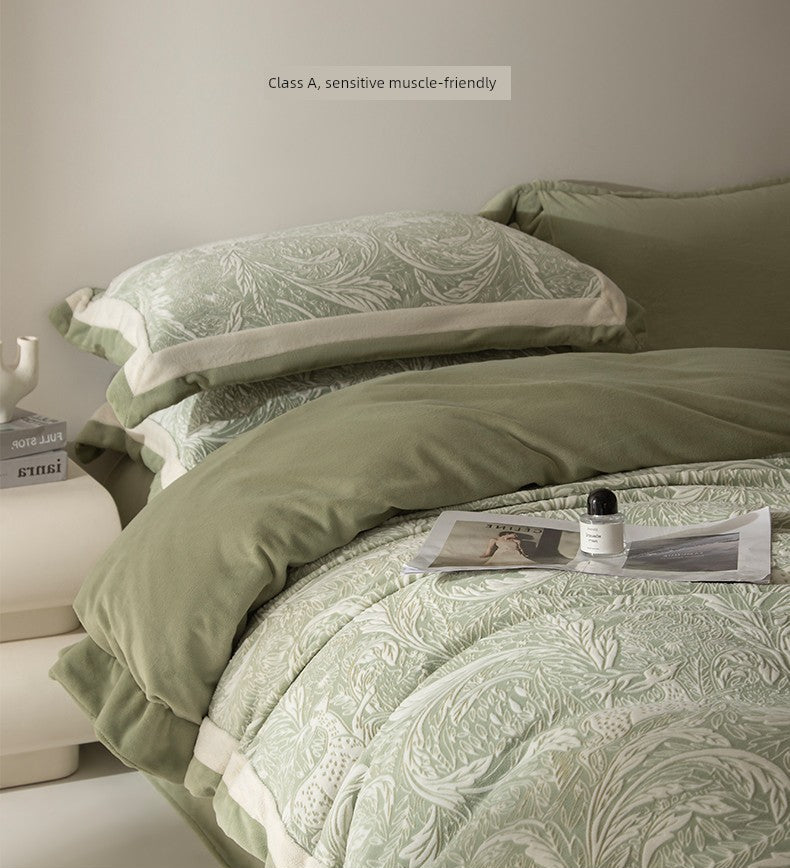 Green floral bedding set on a bed with a neutral background