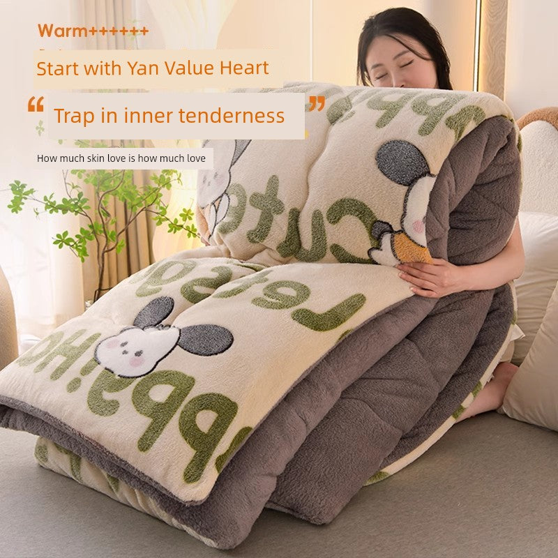 Person wrapped in a plush blanket with cartoon designs, sitting on a couch.