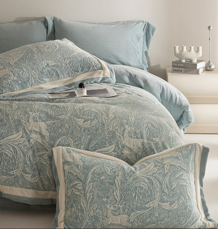Milk fleece bedding set with decorative pillows on a bed in a bedroom setting.