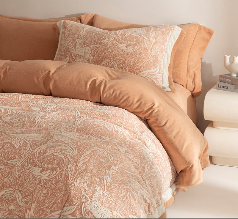 Patterned bedding set on a bed with a neutral color scheme.