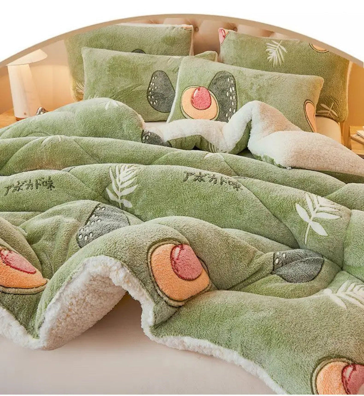 Green plush bedding set with cartoon character design on a bed, featuring the brand 'OURCONMOS'.