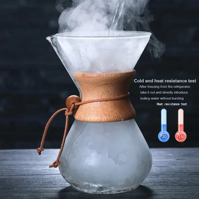 Glass coffee maker with wooden collar on a dark background