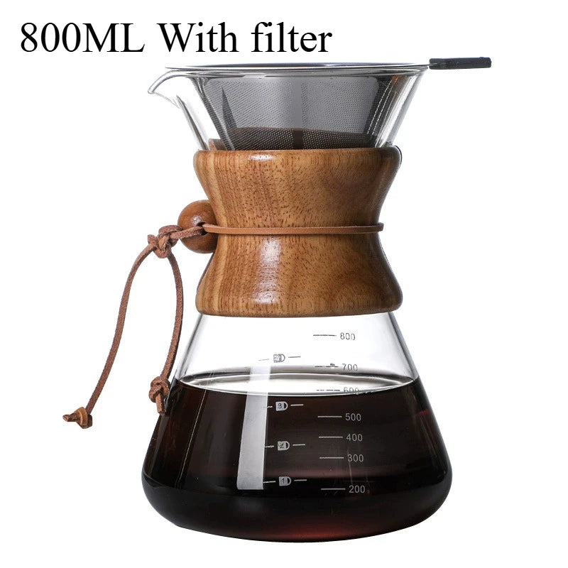Wooden coffee maker with glass carafe and filter on a white background