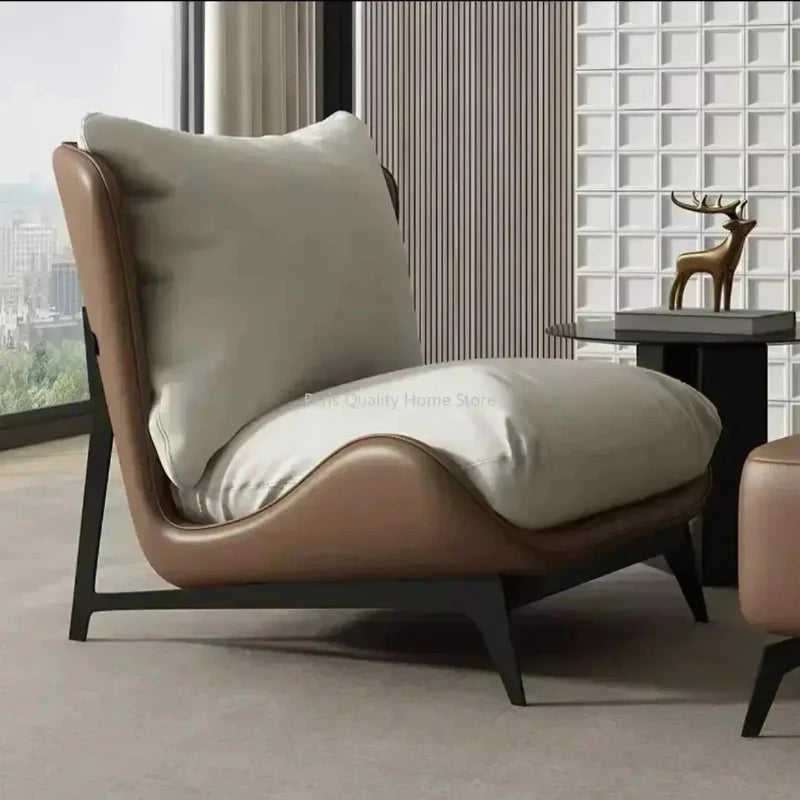 Modern brown armchair with a large cushion in a stylish room.