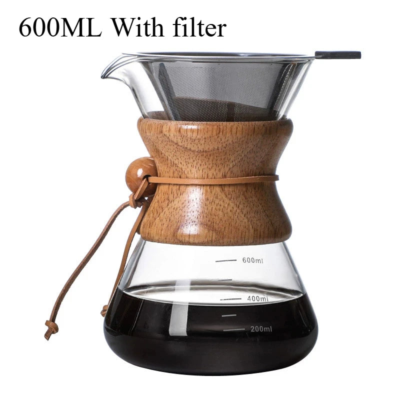 Wooden coffee maker with glass carafe and filter on a white background
