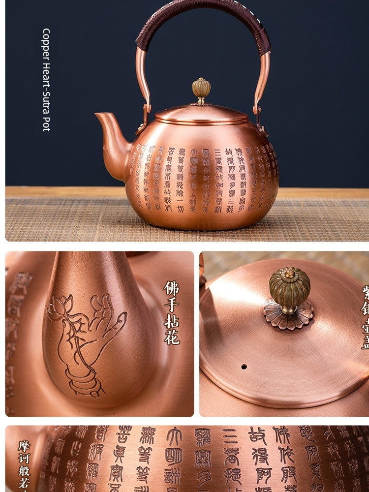 Copper teapot with intricate designs on a dark background