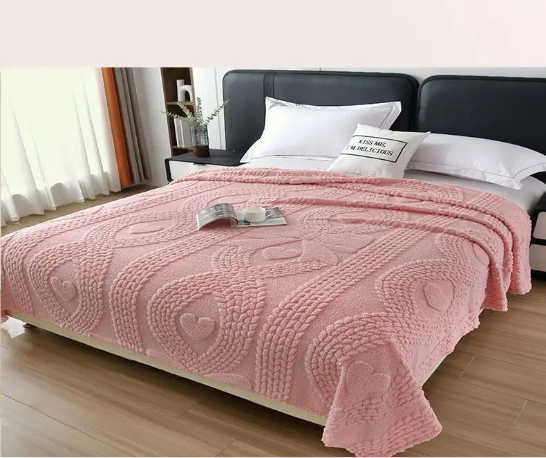 Pink textured blanket on a bed with fabric texture comparison below