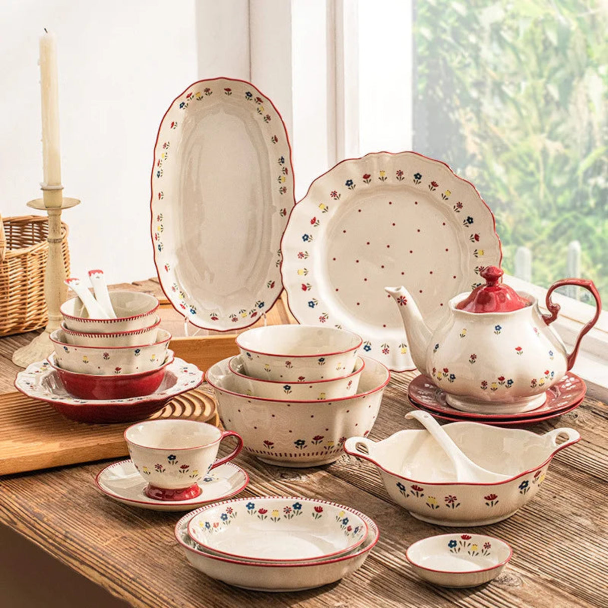 Ceramic dinnerware set with floral patterns on a wooden table.
