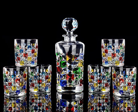 Set of colorful hand-painted glasses with a central decanter on a black background