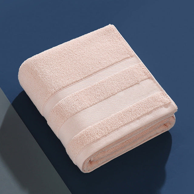 Extra-thick highly absorbent cotton bath towel with unique cutout design in multiple colors