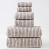 Stack of five striped towels on a white background