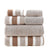 Stack of striped towels in brown, beige, and white on a white background