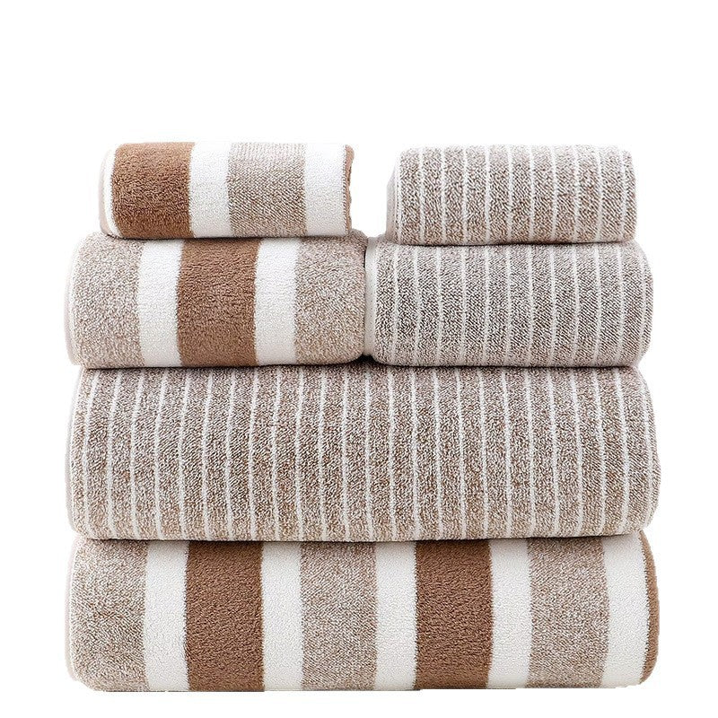 Stack of striped towels in brown, beige, and white on a white background