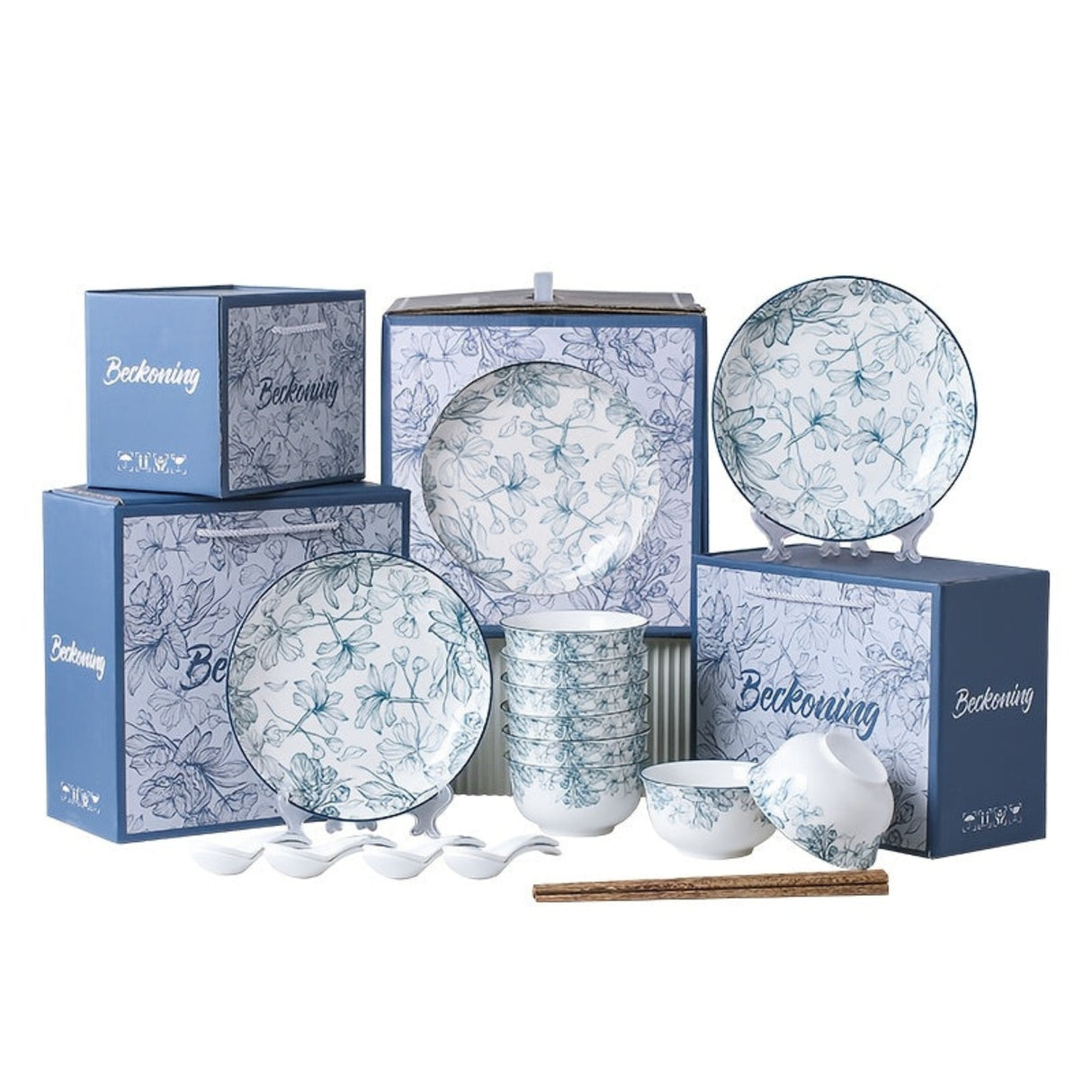 Ceramic tableware set with floral patterns on a white background, featuring boxes and tableware pieces.