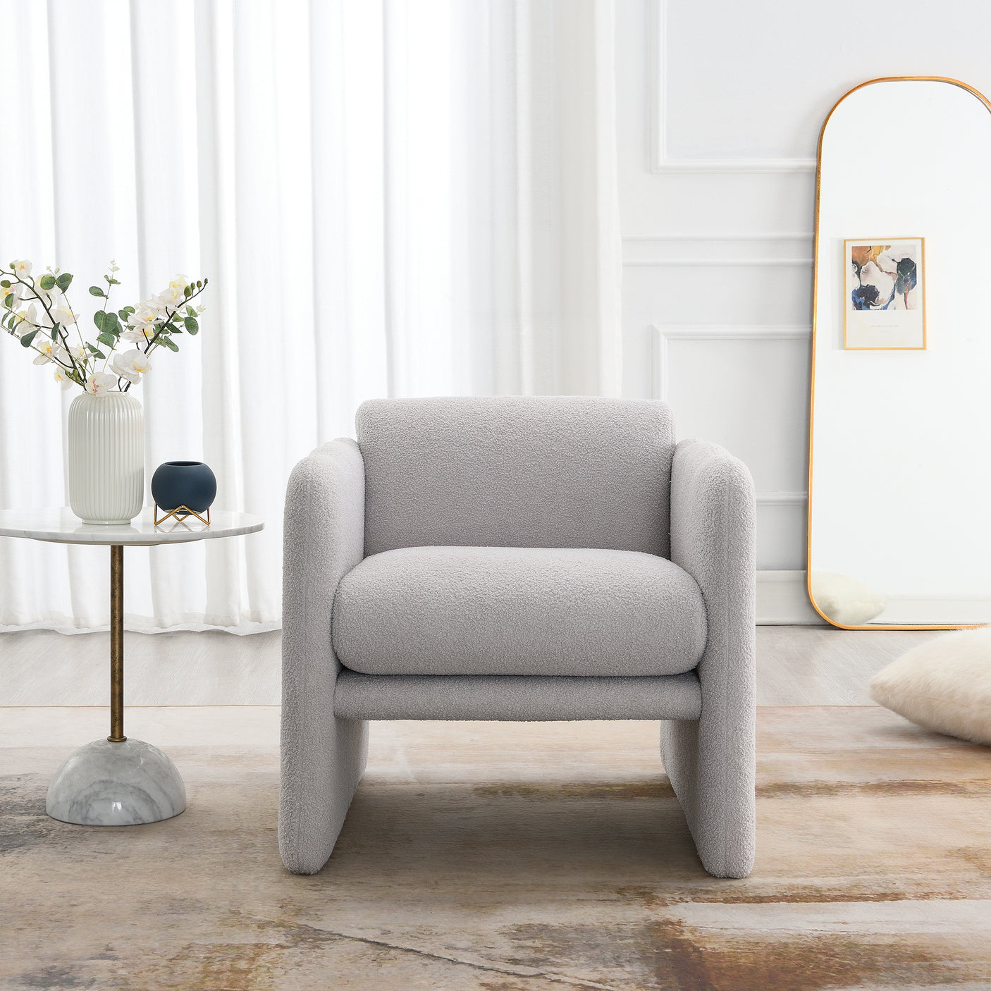 Armchair with wavy armrests, metal decorations on both sides of the armrests, made of Teddy cloth, light gray - Julia M LifeStyles