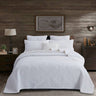 Heirloom Patchwork™ Quilt Collection cotton patchwork quilt set on bed with pillows