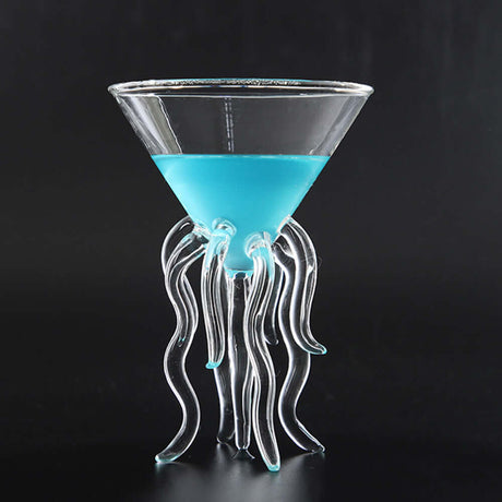 Octopus Cocktail Glass Transparent Jellyfish Glass Cup Juice Glass Goblet Conical Wine Champagne Glass filled with blue drink.