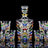Colorful hand-painted glass decanter set with ice crack design on a black background