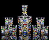 Colorful hand-painted glass decanter set with ice crack design on a black background