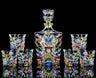 Colorful hand-painted glass decanter set with ice crack design on a black background