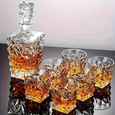 Crystal decanter and glasses with whiskey on a reflective surface