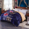 Bedroom with a blue and beige patterned blanket featuring British flags and 'London' text.
