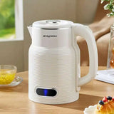White electric kettle on a wooden table with a blurred background