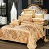 Luxury bedspread set on a bed with intricate designs