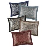 Set of five decorative pillows with paisley patterns in various colors on a white background.