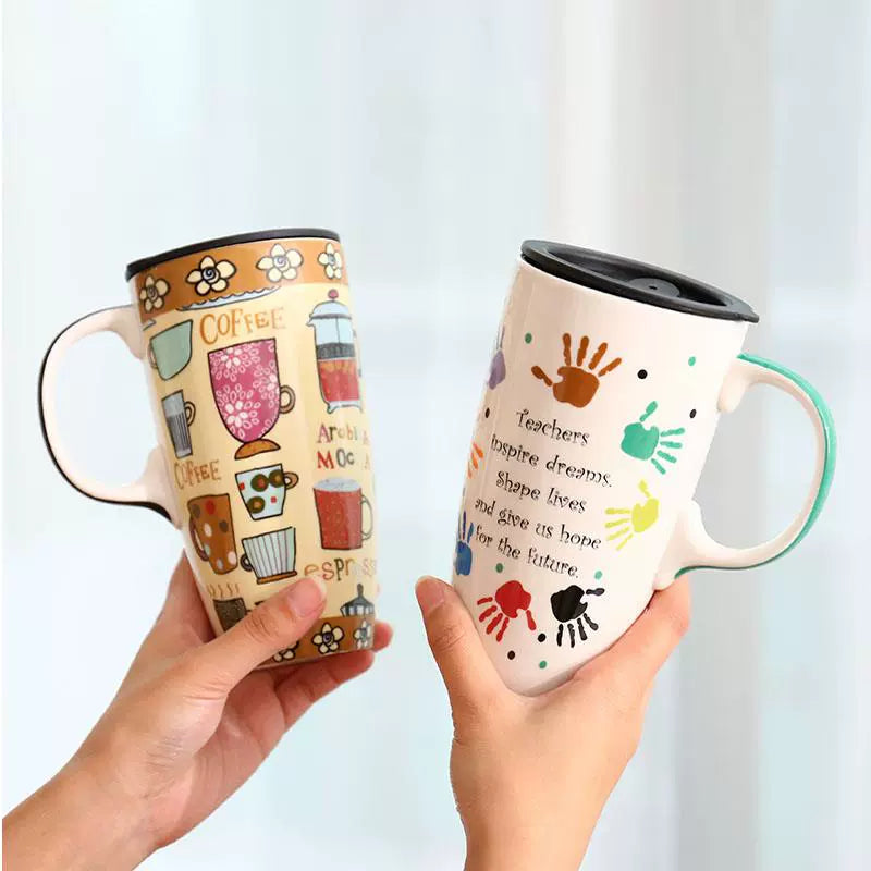Two travel mugs held by hands against a light background