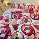 Bedding set with cartoon bear design on a bed in a bedroom setting.